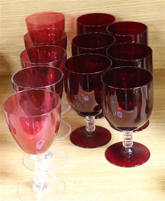 A collection of eleven various red bowled wine glasses